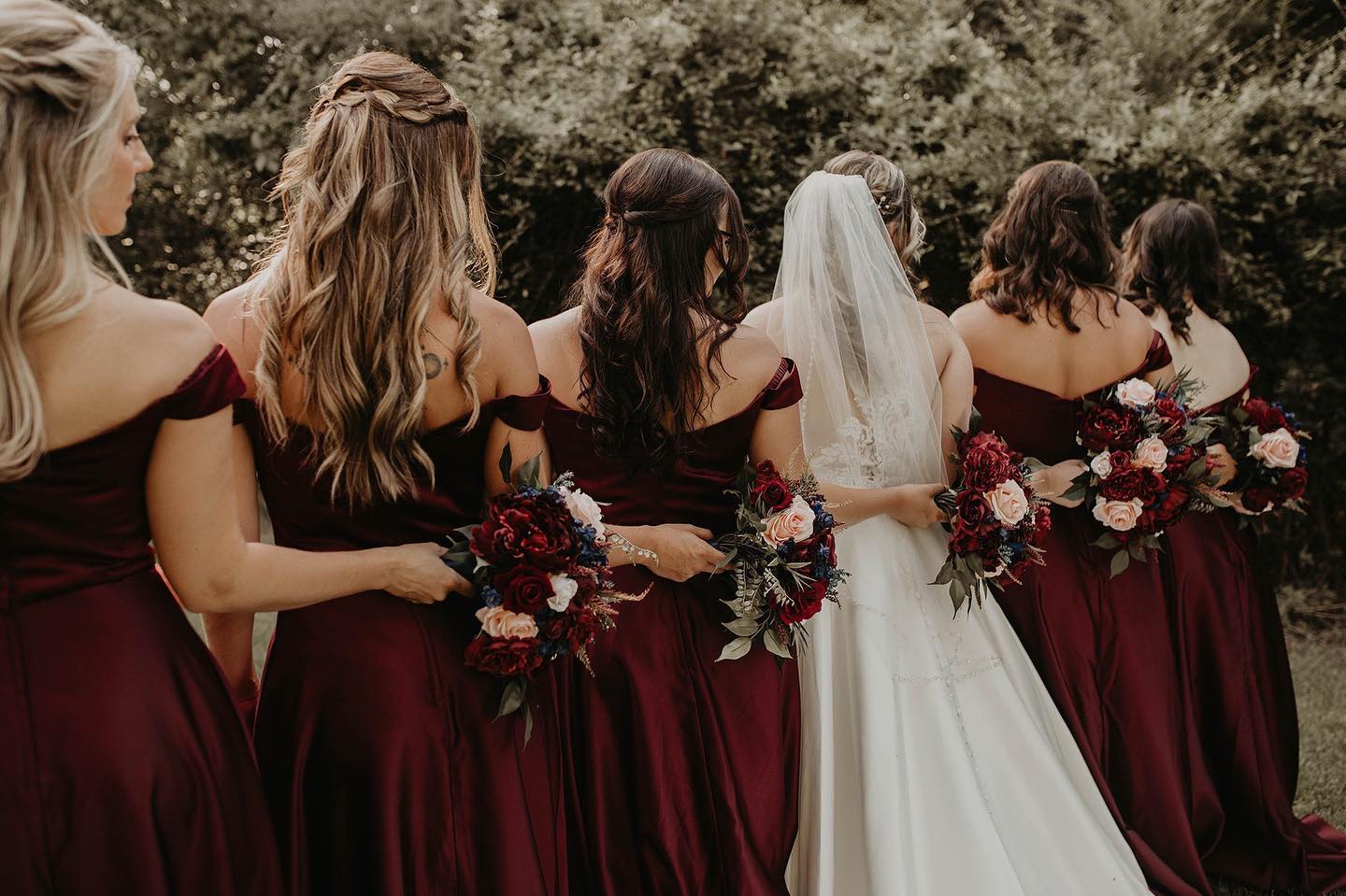 bridesmaids wearing red dresses