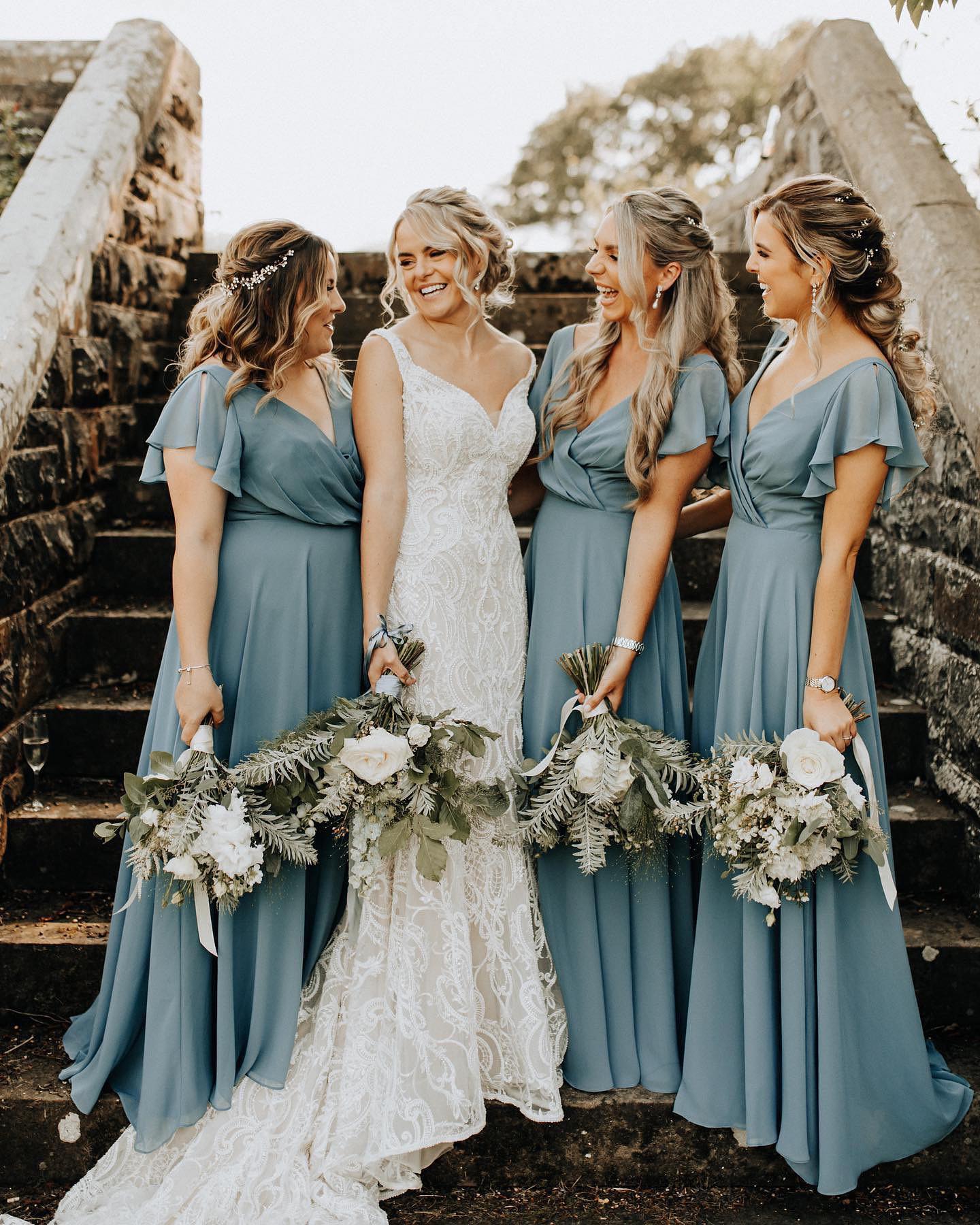 bride and bridesmaids wearing blue bridesmaid dresses