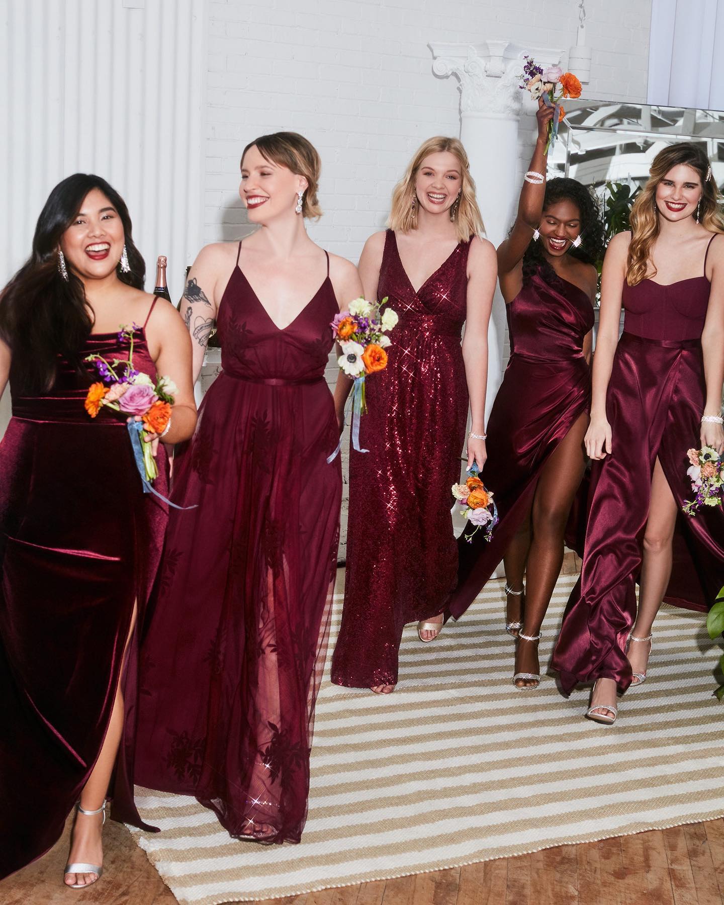 holiday wedding party in red bridesmaid dresses