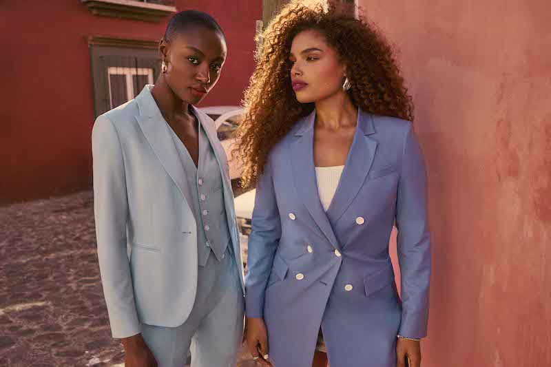 Two women in blue suits