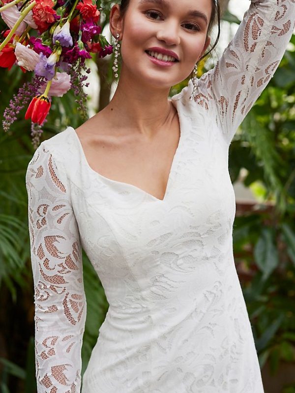 Bride wearing a lace long sleeve wedding dress