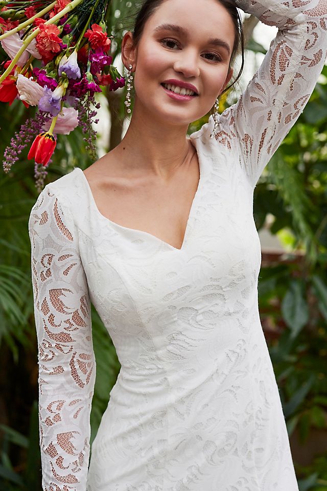 Romantic lace wedding dress with sheer sleeves, traditional bridal